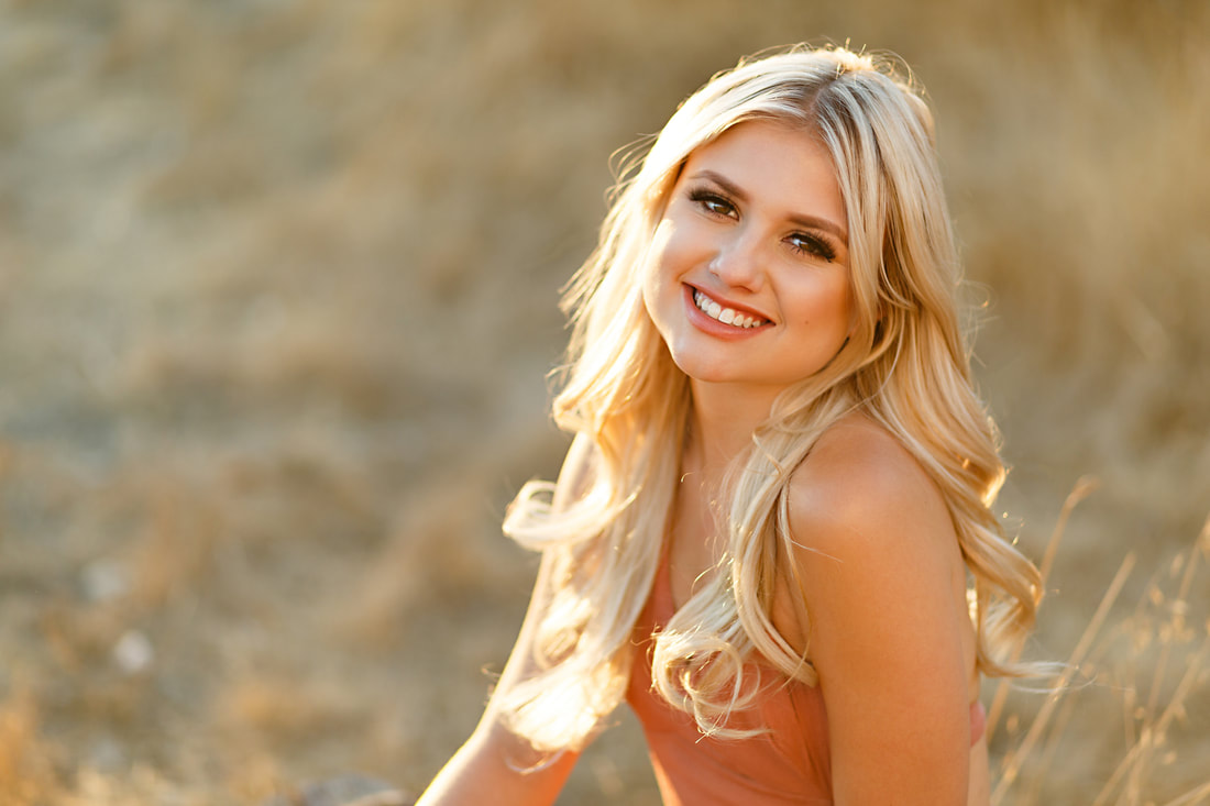 The fields in Livermore make for a beautiful backdrop for this high school senior girl's tight headshot